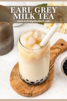 an iced drink in a glass with ice cubes on the rim and text overlay that reads, earl grey milk tea