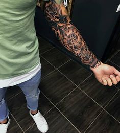 a man with a tattoo on his arm