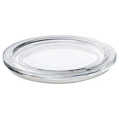 a clear glass plate sitting on top of a white table