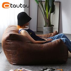 a person sitting on a bean bag chair