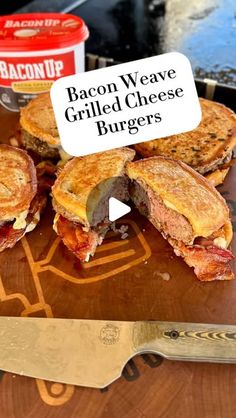 bacon weave grilled cheese burgers on a cutting board with a knife next to it