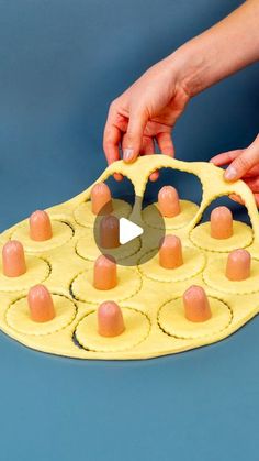 a person is making an egg carton out of doughnut holes