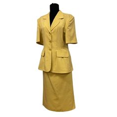 Offering this lovely vintage 1970s two-piece art deco two piece yellow suit set, perfect for summer and spring with its lightweight linen-cotton blend fabric. The jacket has large buttons in the front, and has short sleeves. Throughout its journey in time, this lovely jacket had shoulder pads at some point but the previous owner cut them as you can see in the photographs. The skirt is an A line cut with a back zipper closure and button.  Size: Skirt Length: 86 cm / 34 in Waist: 40 cm / 15.10 in It’s A Wonderful Life, 70s Skirt, Yellow Suit, Yellow Springs, Skirt Suit Set, Yellow Outfit, Large Buttons, Suit Set, Pale Yellow