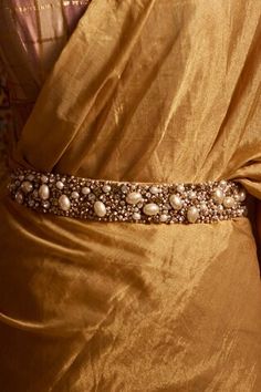 Ivory waistbelt with crystal embellishments, chain detail and  pearl stones. 
Embroidered
Composition: Velvet
Color: White
Size : 4.3 x 65 x 1
Hook detail - Aza Fashions Pearl Belt, Formal Belts, Velvet Belt, Popular Earrings, Tarun Tahiliani, Silver Ear Cuff, Floral Bags, Beaded Belt, White Velvet