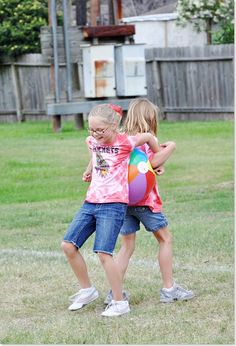 Beach Ball Race- kids work together to hold beach ball between their backs for the first leg of the race, then their sides, then elbows. The field Day Challenge is halfway down on web site & includes water relay, tricycle race, and tug-of-war. Check it out! Picnic Games, Kids Work, Team Building Games, Relay Races, Outdoor Games For Kids, Building Games, Water Games