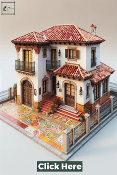 a model of a house with red tile on the front and side walls, windows, and balconies