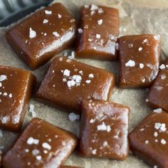 there are many pieces of caramel on top of the paper bag that is filled with sugar