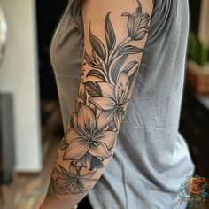 a woman with a flower tattoo on her arm