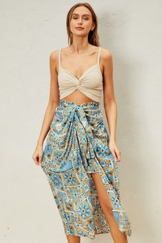 Indulge in your Moroccan dreams with our Sunrise Vacay Skirt! Featuring a stunning print and a flattering ruching effect, this satin skirt will be the center of attention on your next vacation. The full elastic waistband ensures a comfortable fit, while the unique design adds a touch of elegance to your wardrobe. PRE-ORDER 06/14/24 Fabric & fit: 100% rayon Model is wearing size small. Beach Rayon Tiered Skirt, Rayon Tiered Skirt For Beach, Rayon Tiered Skirt For The Beach, Summer Rayon Skirt For Vacation, Vacation Rayon Midi Skirt, Vacation Midi Rayon Skirt, Vacation Long Rayon Skirt, Rayon Midi Skirt For Vacation, Long Rayon Skirt For Vacation