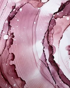 an abstract painting with pink and purple colors on it's surface, as well as bubbles