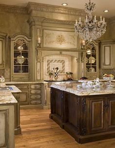 a fancy kitchen with an island and chandelier