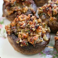 some stuffed mushrooms are sitting on a plate