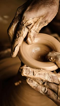 an image of someone making pottery on a potter's wheel with the caption in arabic