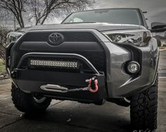 the front end of a gray toyota truck