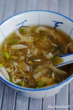 a close up of a bowl of soup on a table