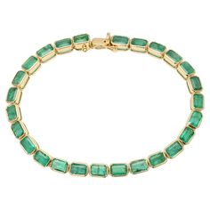 This Vivid Green Natural Emerald Tennis Bracelet Mounted in 18K gold showcases 26 endlessly sparkling natural emerald, weighing 12.5 carat. It measures 7.5 inches long in length. Emerald gemstone enhances the intellectual capacity of the person. Designed with perfect octagon cut emerald to make you stand out on any occasion or event. The elegant style complements the attire beautifully and is a perfect gift for anyone on your list. PRODUCT DETAILS :- Material - 18K Solid Yellow Gold Gemstone - E Emerald Bracelets, Emerald Tennis Bracelet, Bracelet Tennis, Emerald Bracelet, Gold Armband, Emerald Stone, Emerald Gemstone, Natural Emerald, Tennis Bracelet