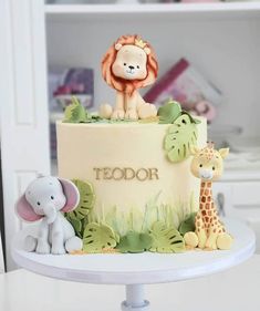 there is a cake that has animals on it