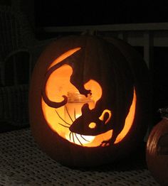 a carved pumpkin with a cat on it