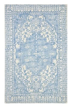 a blue and white rug with an intricate design