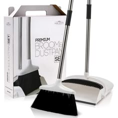 the broom and duster are set up in front of a box with its lid open