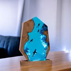 a sculpture made out of wood and glass on top of a table