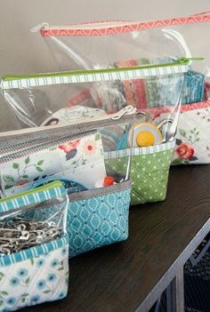 several zippered bags lined up on a table