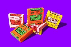 four boxes of wheyly veggie on a purple background