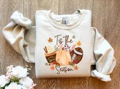 Celebrate the cozy spirit of the season with this "T Is The Season" sweatshirt. Embrace the autumn vibes and the excitement of fall football games with this stylish and comfortable hoodie. Whether you're picking pumpkins at the patch, enjoying the crisp air on a fall day, or sipping your favorite fall coffee blend, this shirt is perfect for all your fall activities. This women's Halloween shirt features a fun and festive fall graphic tee design that adds a touch of seasonal charm.

T Is The Season Sweatshirt, Fall Football Hoodie, Pumpkin Patch Shirt, Autumn Shirt, Women's Halloween Shirt, Fall Graphic Tee, Fall Coffee, Cozy Spirit, Autumn Vibes, Fall Season, Fall Football Games, Football Fans, Pumpkin Patch Adventure, Crisp Air, Fall Day, Fall Activities, Fall Fashion, Stylish Hoodie, Com Fall Football, Patches Shirt, Football Sweatshirt, Autumn Coffee, Pumpkin Shirt, Fall Sweatshirt, Halloween Sweatshirt