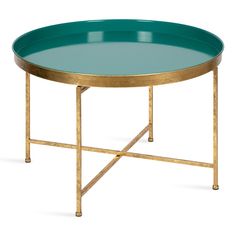 a round table with gold legs and a green tray on the top that has a golden frame around it