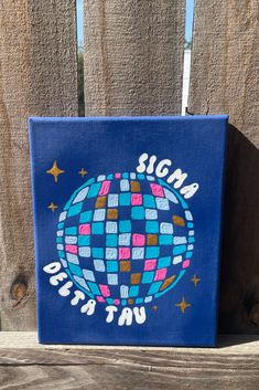 a blue canvas with an image of a disco ball on it that says, signa dicta tu