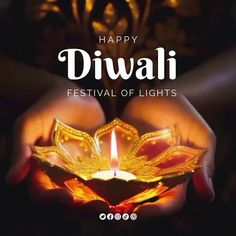 someone holding a lit candle in their hands with the words happy diwali festival of lights