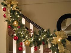 christmas garland on the banisters decorated with gold and red ornaments