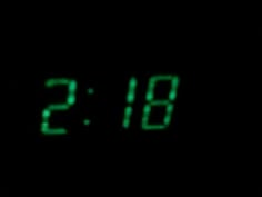 the digital clock is green in the dark