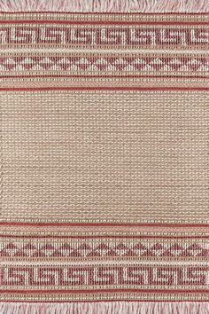 a red and white rug with fringes on it