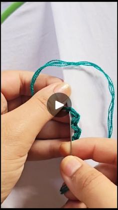 someone is crocheting something with green yarn