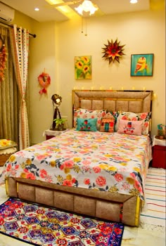 a bedroom with a bed, rugs and pictures on the wall above it's headboard