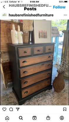 an old dresser has been painted black and brown