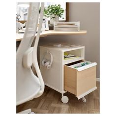 a white desk with two drawers and a chair in the corner next to it on a hard wood floor