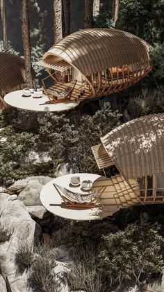 two wooden tables and chairs in the woods