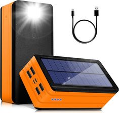 an orange solar powered device next to a charger