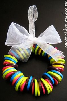 colorful bracelets with white ribbon on black background