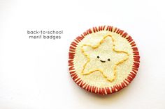 a brooch with a star on it and the words back - to - school merl badges