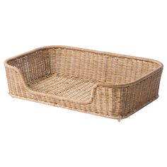 an empty wicker dog bed on a white background