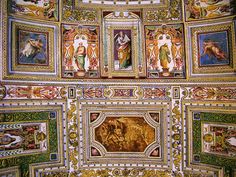 an ornate ceiling with paintings on it