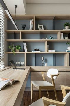 an office with wooden shelves and white chairs