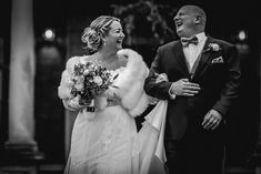 a bride and groom walking down the aisle at their wedding ceremony in black and white