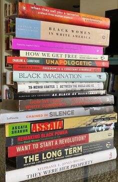 a stack of books sitting on top of a table