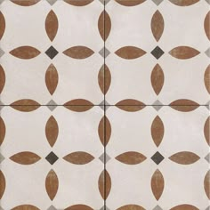 a white and brown tiled floor with circles on it