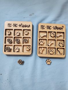 two wooden trays that have different types of dog paw prints on them