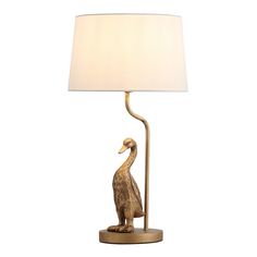 a lamp that has a bird on it